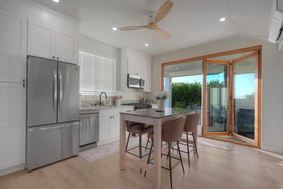 Cantina doors open up kitchen wall to patio