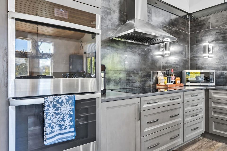 Kitchen: Main floor, drip coffee maker, Keurig, toaster, air fryer, cooking utensils, tableware