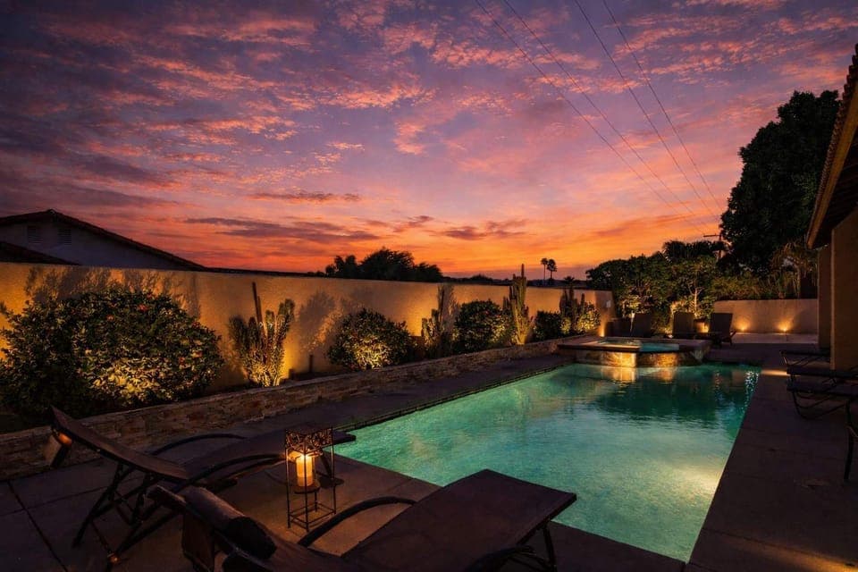 Outdoor Pool Area. Some exterior lighting shown in this image may not be present or turned on during your stay.