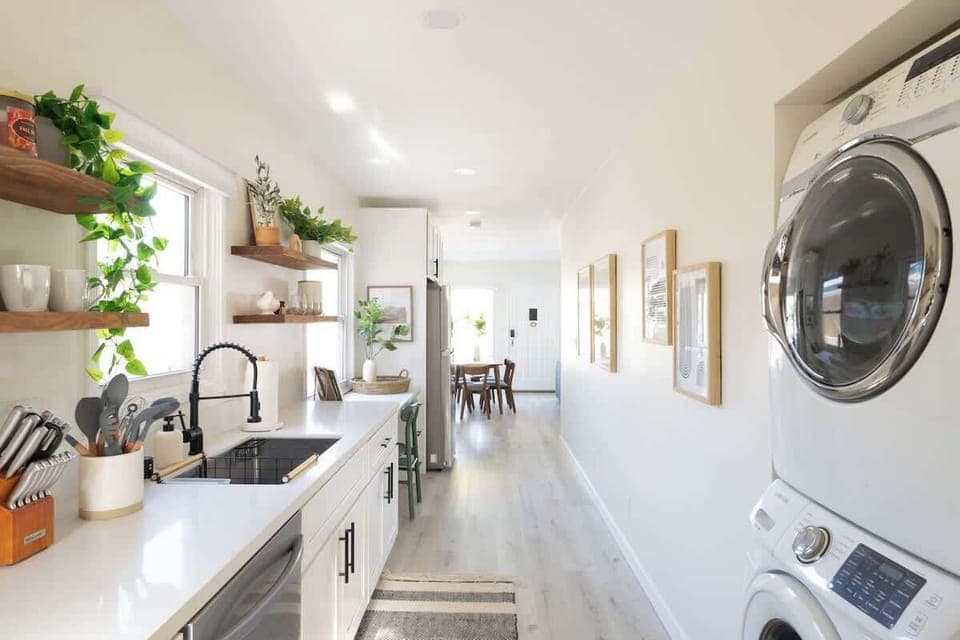 Wash, clean and dry in the galley-style kitchen with an attached laundry nook