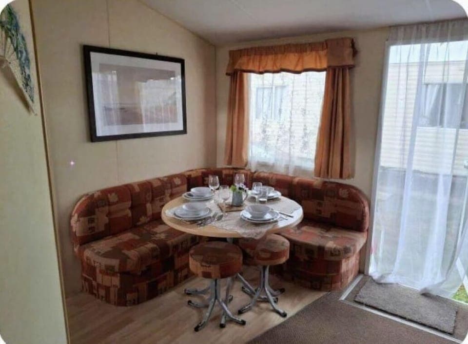 Cozy dining nook with natural light and garden views