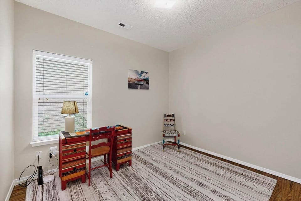 Private, quiet workspace with desk and chair, ideal for remote work or emails.