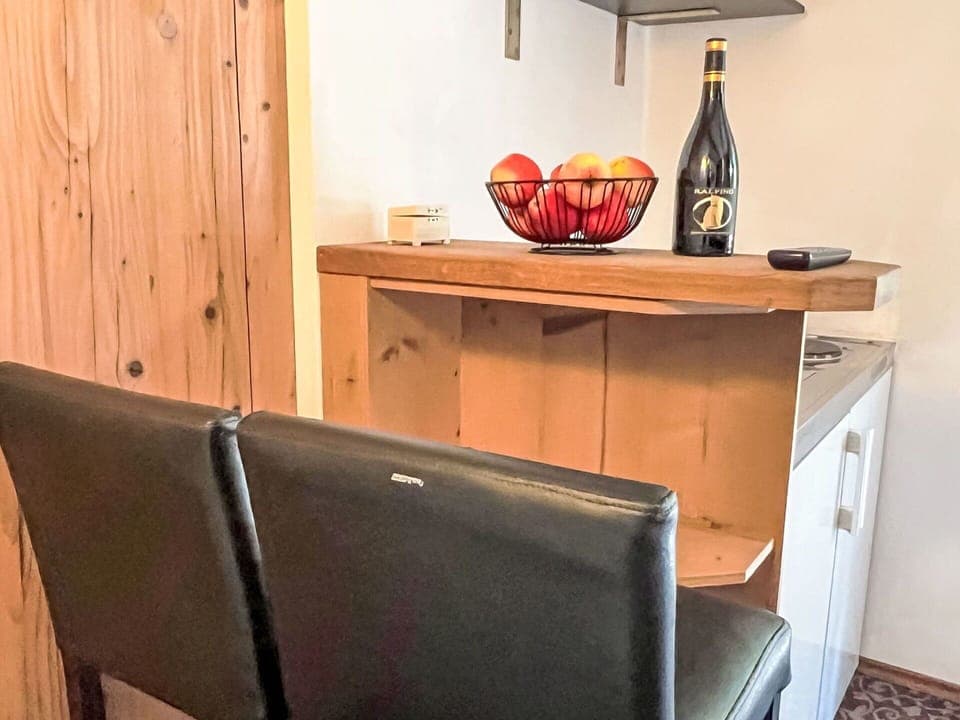 Furniture, Wood, Flooring, Interior Design, Floor, Countertop, Wood Stain, Room, Cabinetry, Hardwood