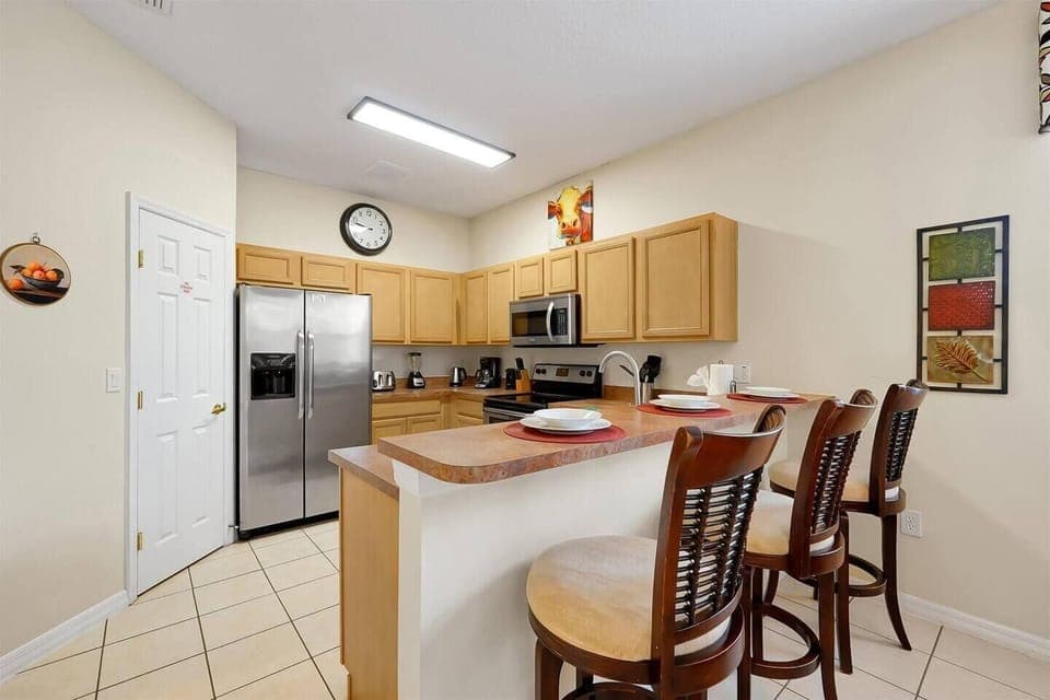 Spacious kitchen with bar, open to the breakfast room