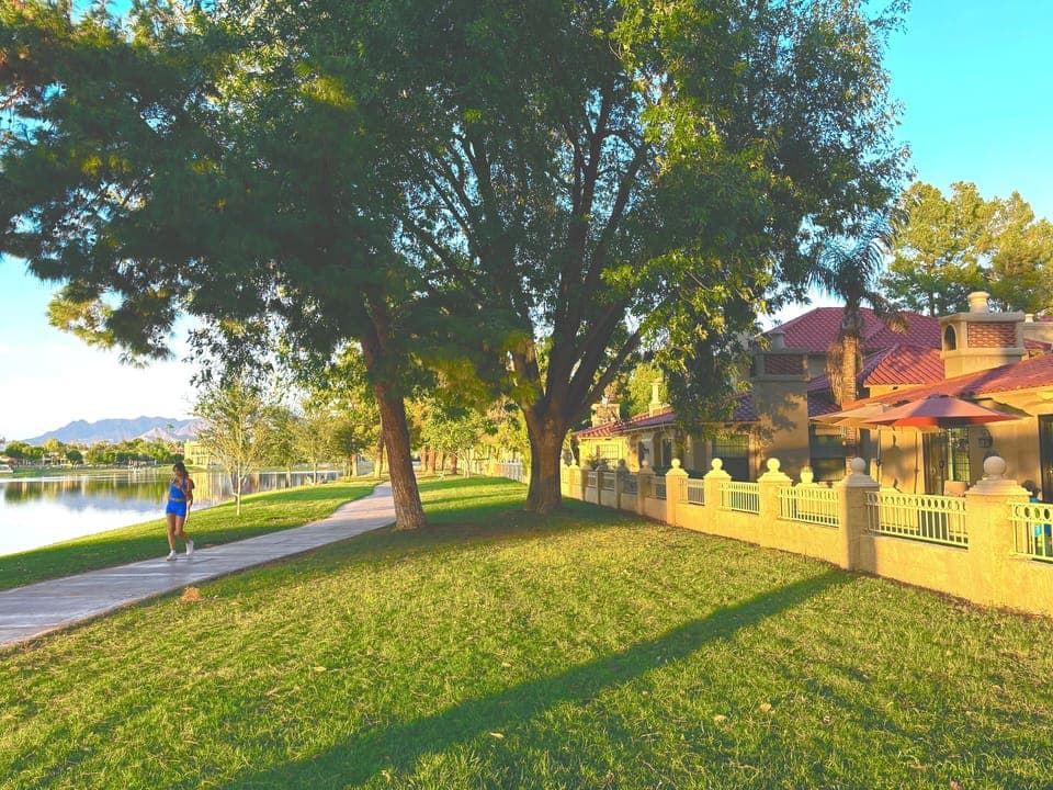 Your Villa  fronts on McCormick Lake & 28 Mile Path with Mountain Background