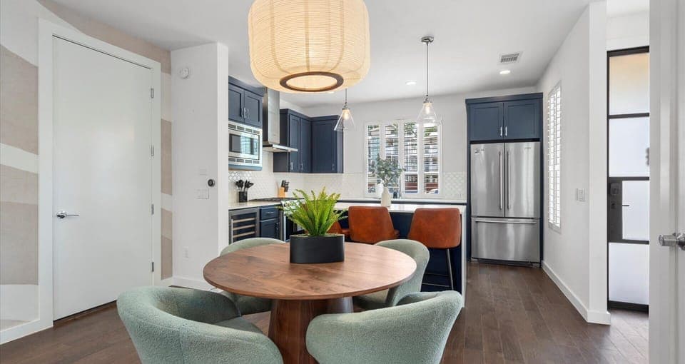 Share meals and memories around this inviting dining table, designed for both comfort and style with plenty of natural light to set the scene.