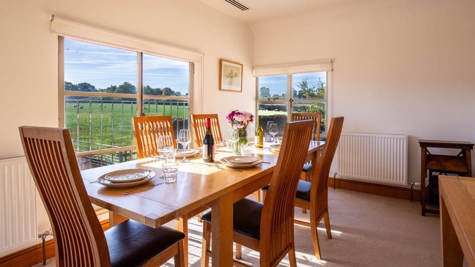 The dining room at Stockmans Cottage overlooks the farmyard and surrounding fields.