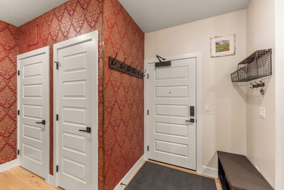 Entryway with a bench and hooks