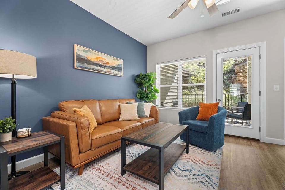 The main living space is comfortable with lots of natural light and deck access!