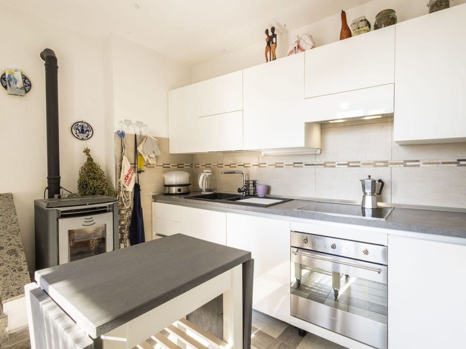 Kitchen Appliance, Kitchen, Countertop, Major Appliance, Furniture, Cabinetry, Flooring, Interior Design, Kitchen Stove, Home Appliance