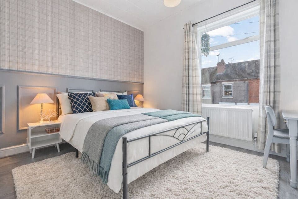 The master bedroom has a comfortable king size bed with fresh linen and towels provided.