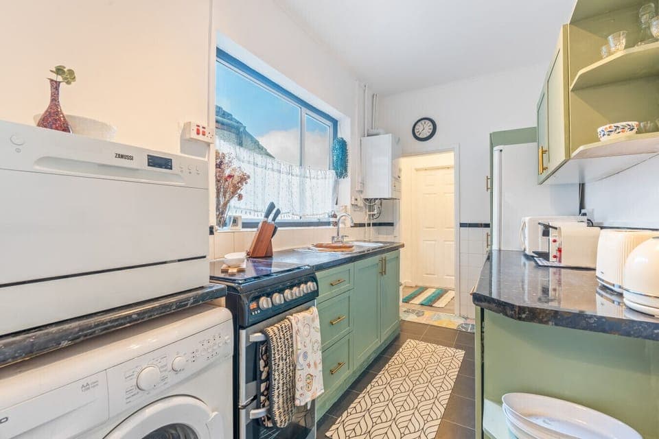 Cook with ease in the fully equipped kitchen, complete with all the cookware, utensils, and appliances you need for a home-cooked meal.