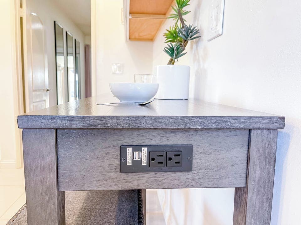 Stay connected with built-in USB ports at the dining and work area.