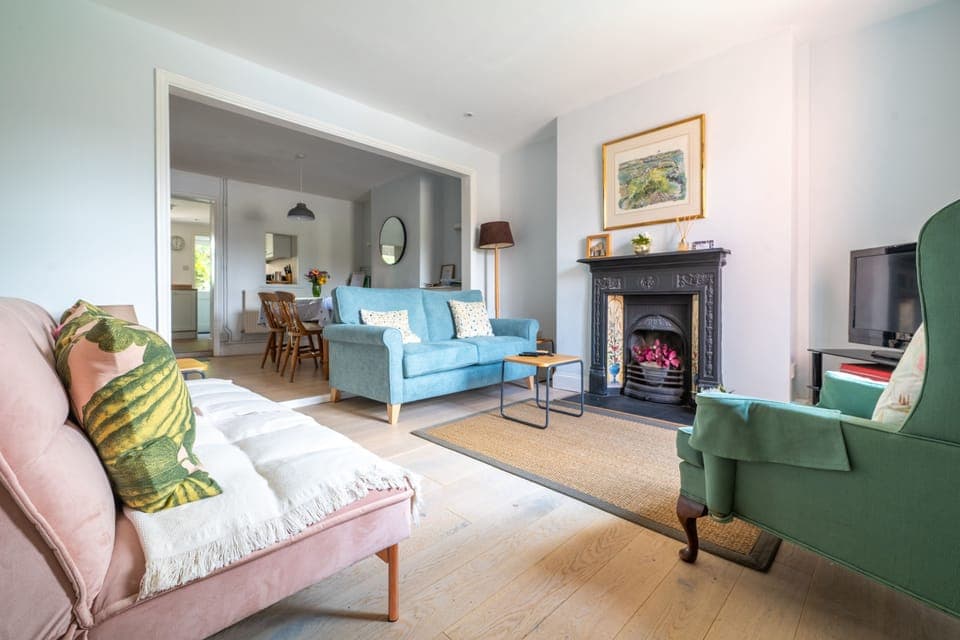 Dragonfly Cottage, Holt: A lovely sitting room with an ornamental fireplace