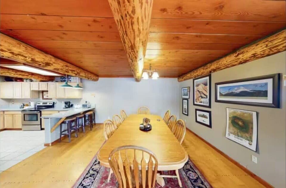 Dining area: Main floor, table seating for 9, 3 barstools, patio access
