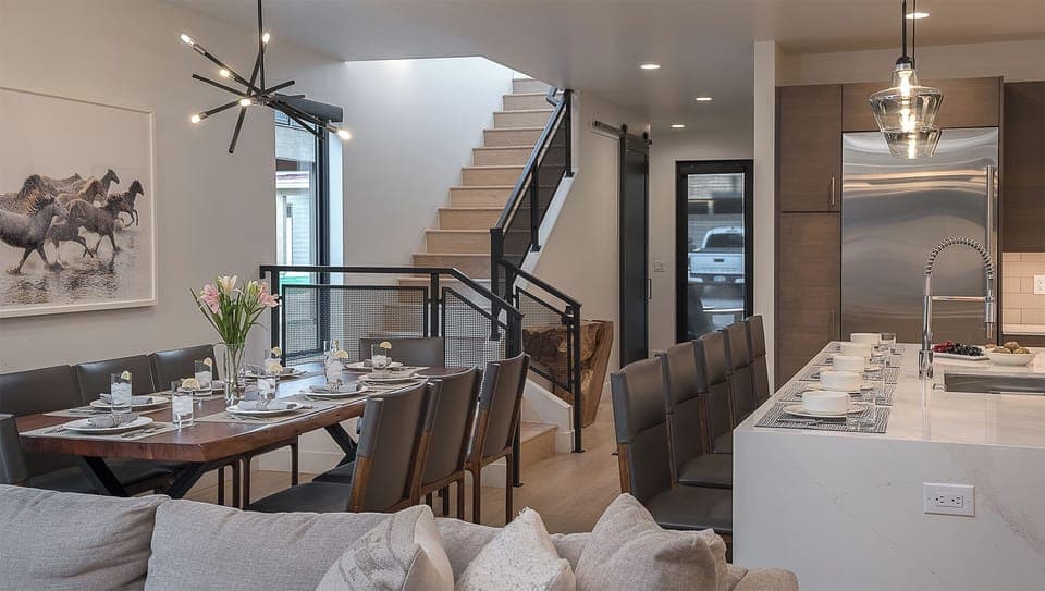 Great Room, Main Level, Principal House - Spacious dining table with seating for 8 and open layout to the kitchen