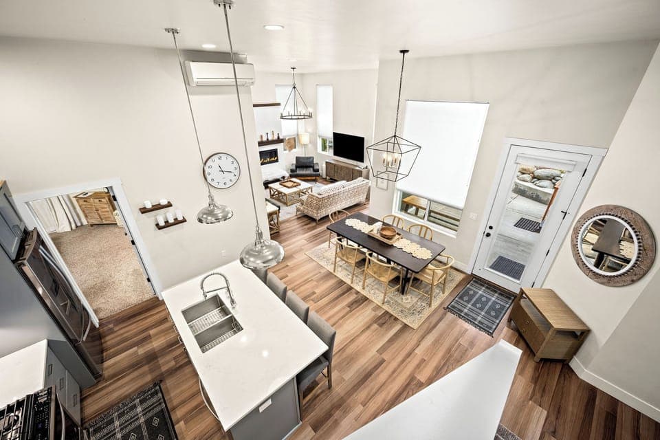 View from stair to upper suite.  Living, Dining, Kitchen, door to patio, primary