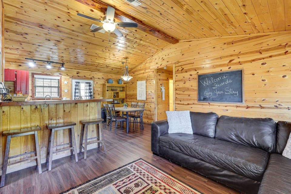 Cozy living room with fireplace and relaxing river-view windows.
