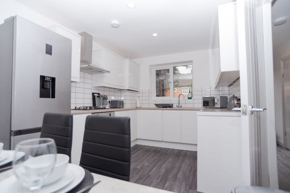 Fully equipped dining kitchen area - perfect for team or family meals, with everything you need for easy, comfortable self-catering.
