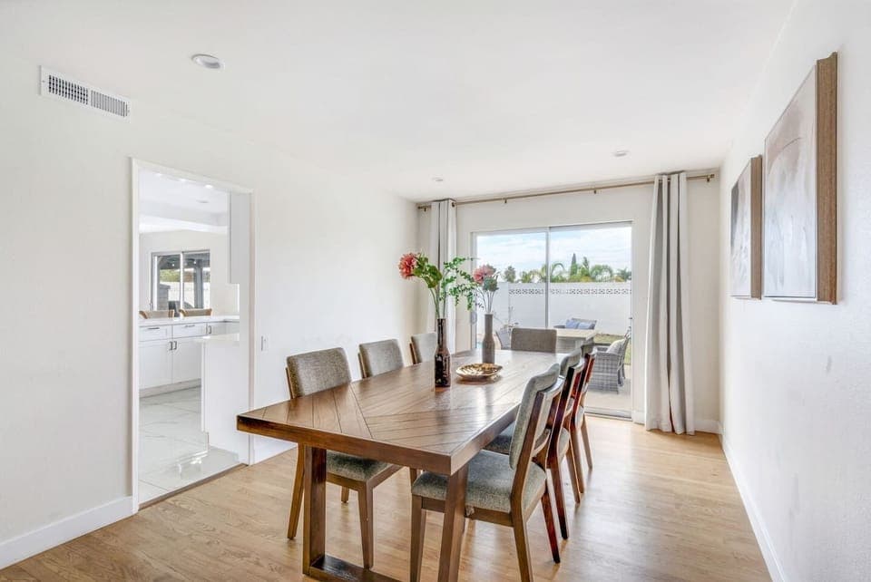 Enjoy family dinners or morning coffee in this airy dining space with direct backyard views.