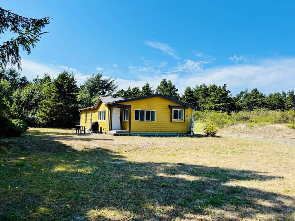 Quiet house with lawn and forest views, a short few minute walk to the beach.
