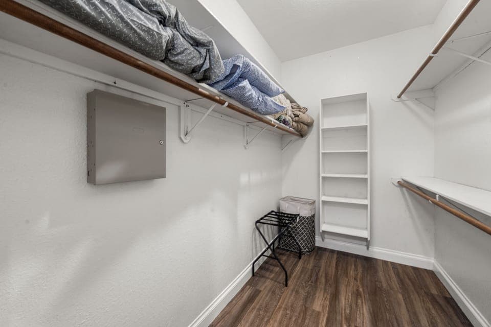 Walk-in closet with bedding for futon, sofa bed, and extra blankets.
