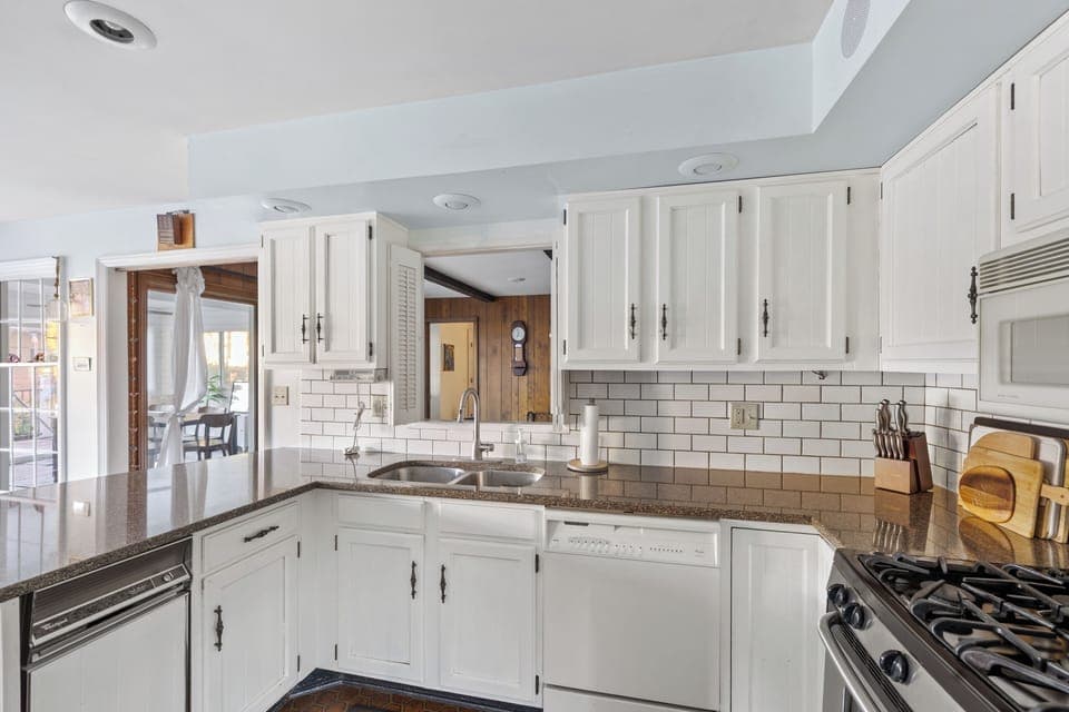 Functional kitchen with a pass-through above the sink, ideal for connecting spaces while cooking.