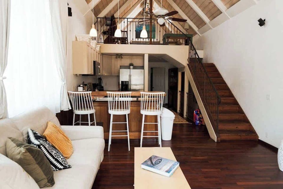 With vaulted ceilings, an open-concept kitchen, and a cozy living room, this space is perfect for families, couples, or solo travelers. Relax in a bright, airy environment with large windows that bring in natural light, and stylish decor.