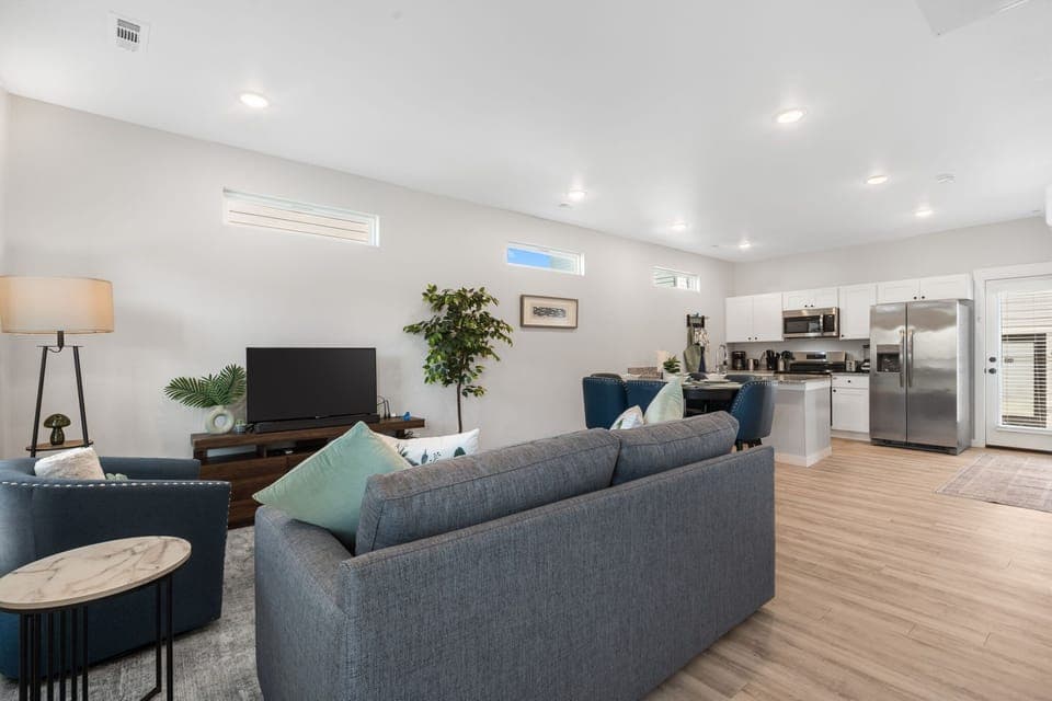 Living room, dining, and kitchen. Stream your favorite entertainment. Sofa pulls out to a sleeper