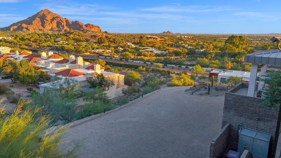 Golden peaks greet the day. Your tranquil desert escape.