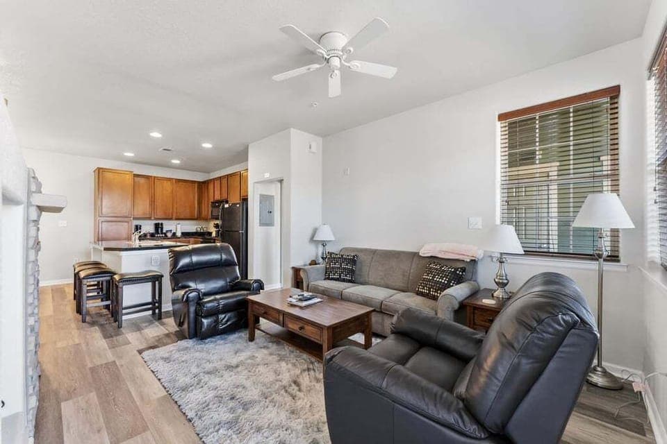 Unwind in your spacious open-concept living space with plush leather seating and a fully equipped kitchen for cooking together.