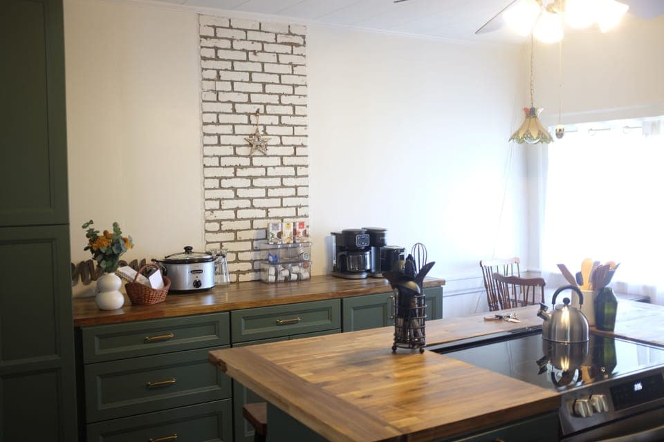 You enter the front door into the fully-stocked kitchen.