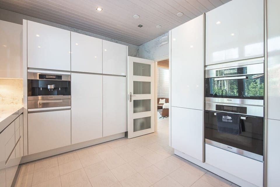 Integrated premium appliances, including built-in ovens and a coffee station, make hosting a breeze throughout your stay.