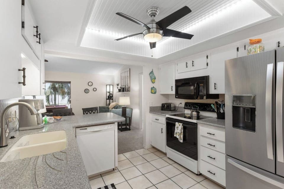 [Kitchen] ~ High-end appliances, Full size fridge with ice maker, Stove, Oven, Microwave, Blender, Toaster, Mixer, Dishware, flatware, and dining utensils