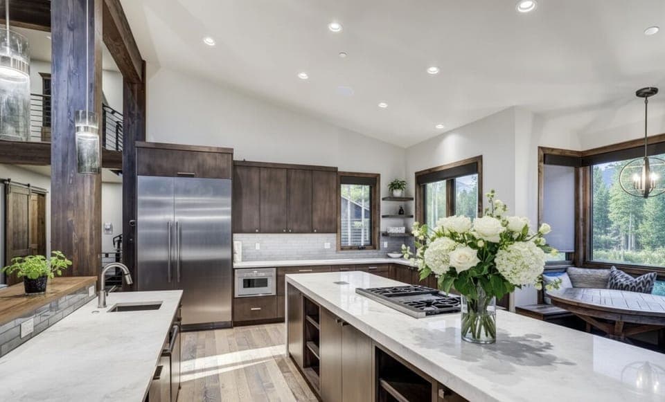 The Chef's Kitchen — where modern luxury meets rustic warmth. Dual dishwashers, beverage station, oversized fridge (plus a second in the garage), and built-in charging ports throughout. 🍷👨‍🍳