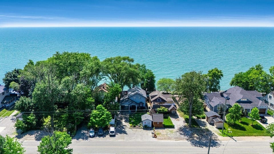 Three side-by-side lakefront homes on Point Pelee Drive