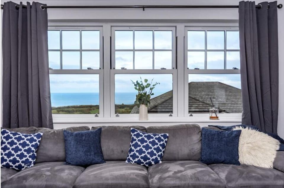 Spacious luxury living room with elegant finishes and uninterrupted sea views.