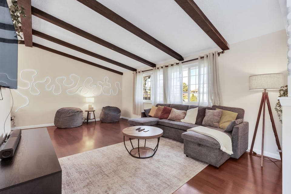 Living room with plush couch and cozy neutral schemes