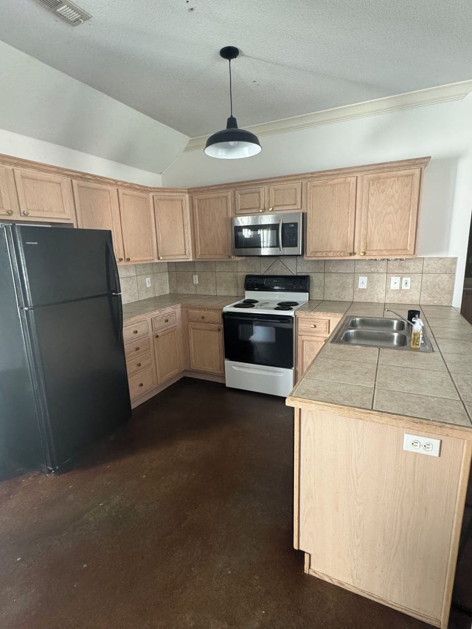 Well stocked kitchen with dishwasher