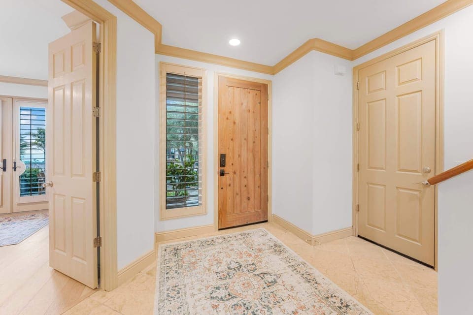 Entry way with garage and first bedroom access
