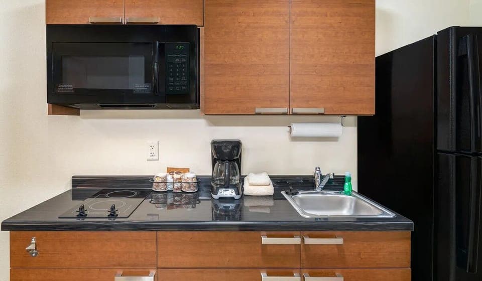 Cook simple favorites with cooktop, microwave, and full fridge.
