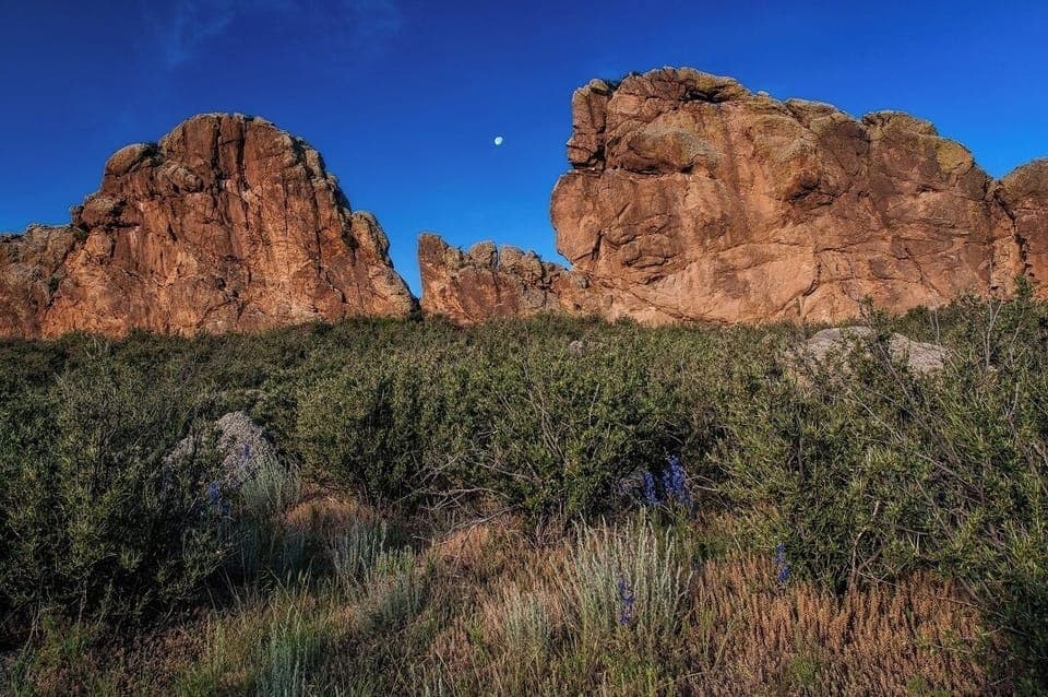 Explore dramatic local rock formations under wide, blue skies.