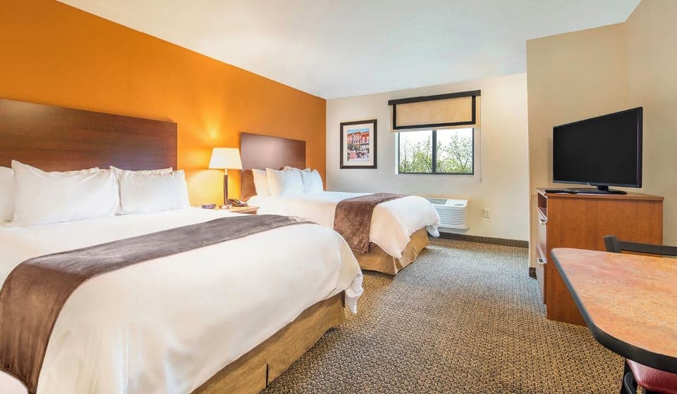 Settle into a spacious double-queen room made for easy rest.