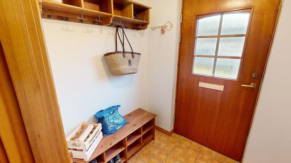 A bright, welcoming hallway that sets the tone for this cosy escape in Aviemore.