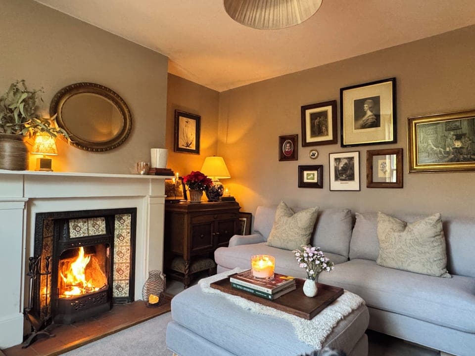 Cosy sitting room with a real open fire - perfect for slow evenings.