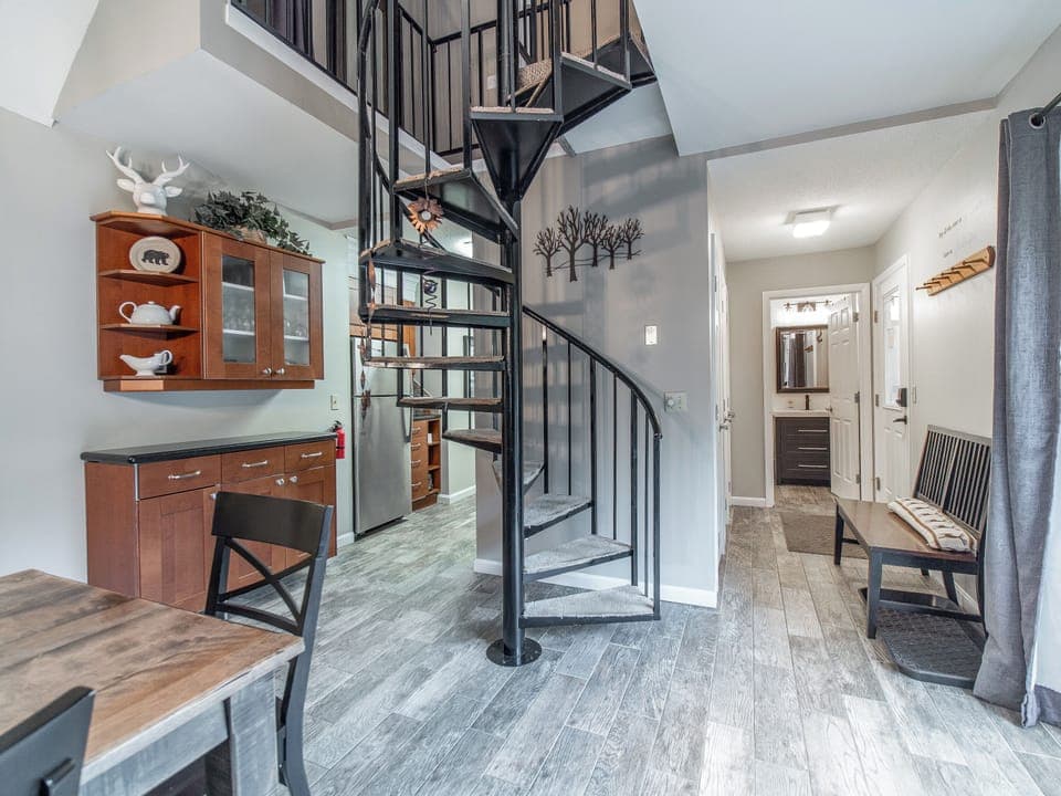 Open concept w/a spiral staircase to access the 2nd floor bedrooms.