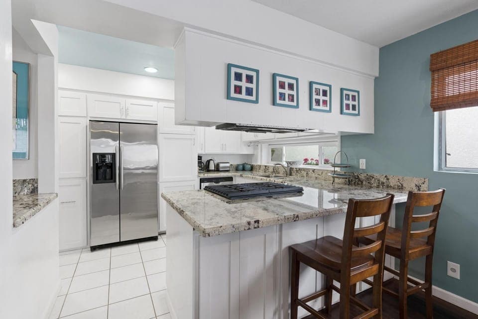 The breakfast bar seats an additional two for a casual, social touch to mealtimes
                