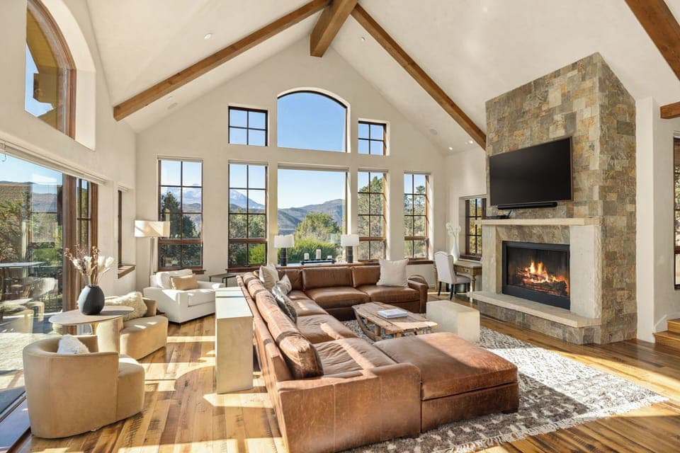 Spacious, elegant main living room with gas fireplace and unobstructed views of Mt. Sopris.