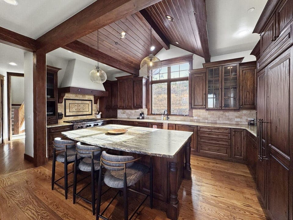 You`re cooking, they`re at the island chatting, mountain views through the window. Enough counter space to spread out, fridge big enough for a week`s groceries. This is how kitchens should be.