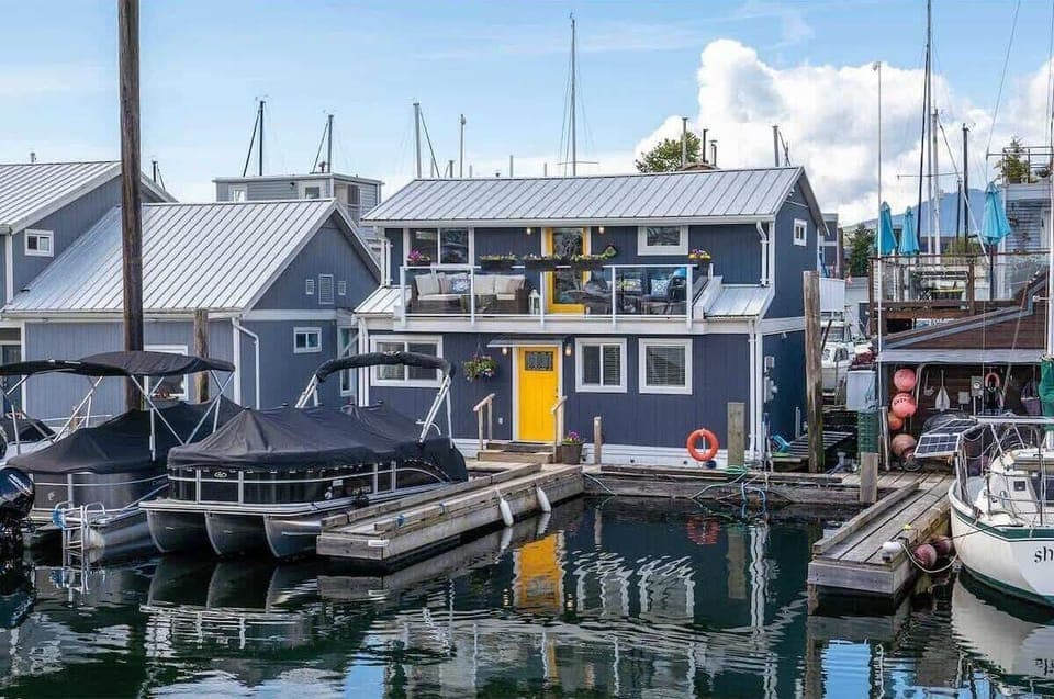 Casa Mica float home does in fact float on the water and boats are right out front.